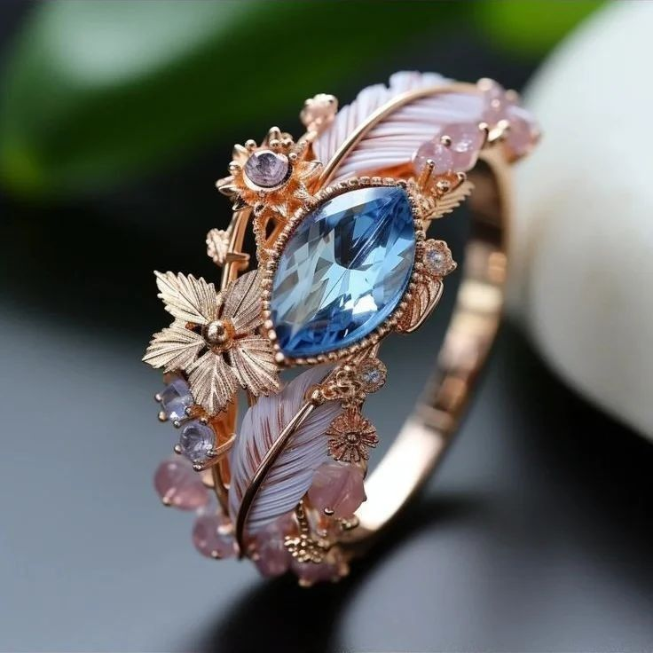 Anello Esotico con Piuma e Cristallo Blu