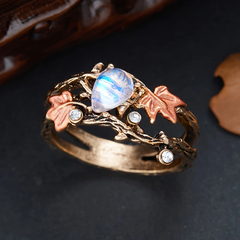 Anello di pietra di luna con foglie e rami
