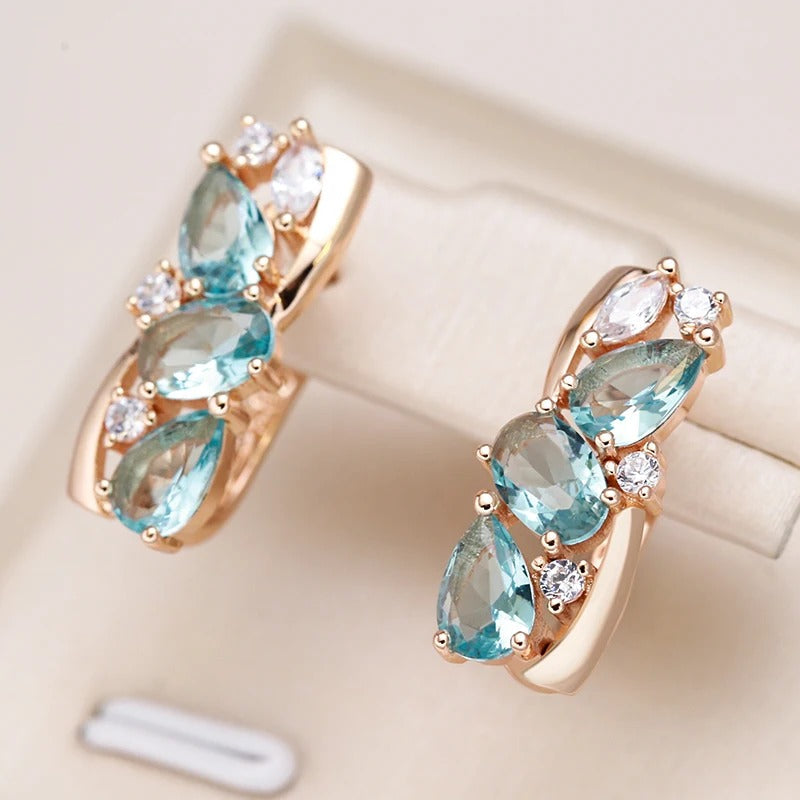 Orecchini pendenti con zircone acquamarina e zircone bianco placcati in oro rosa 18 carati