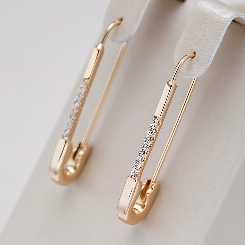 Orecchini pendenti placcati in oro rosa 18K con piccoli zirconi