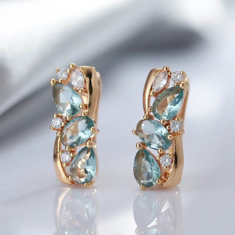 Orecchini pendenti con zircone acquamarina e zircone bianco placcati in oro rosa 18 carati