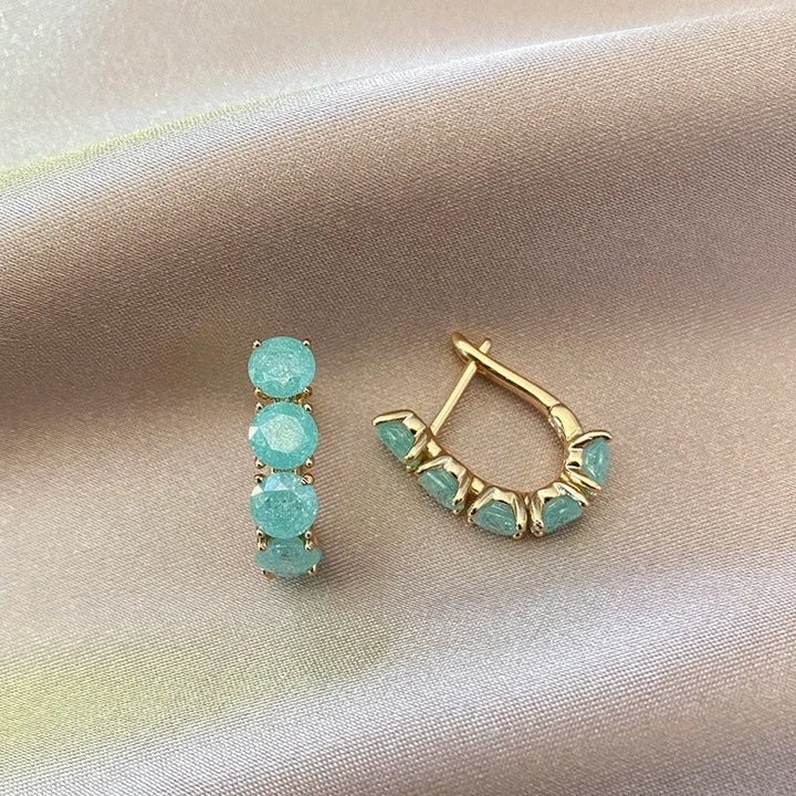 Créoles riempite di zirconi di acquamarina placcate in oro rosa 18K